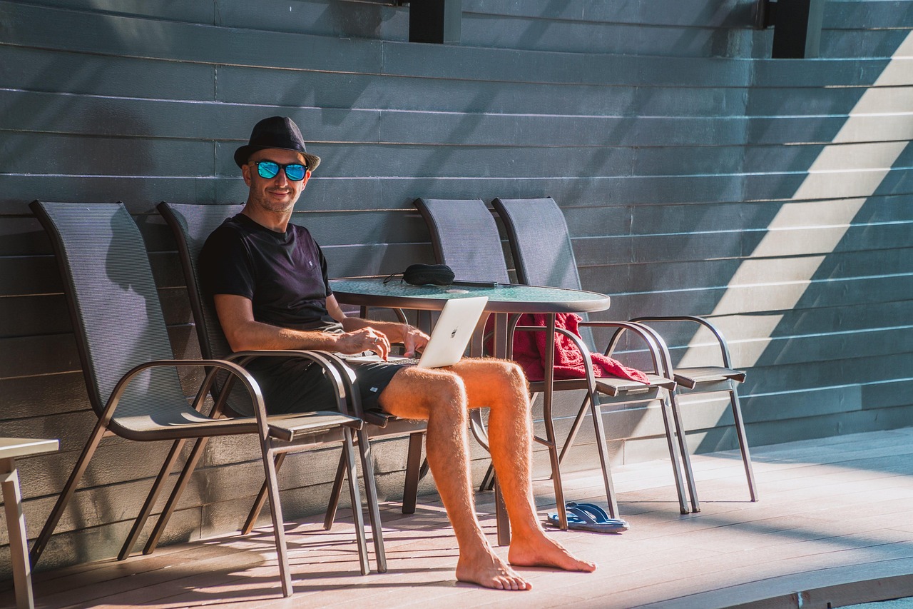 Man, laptop, work — Find a suitable place for accommodation and live happily